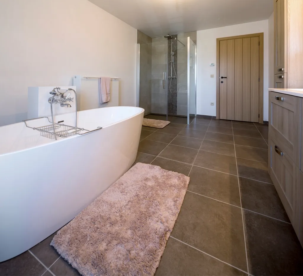 Bathroom with a freestanding tub and a tiled floor