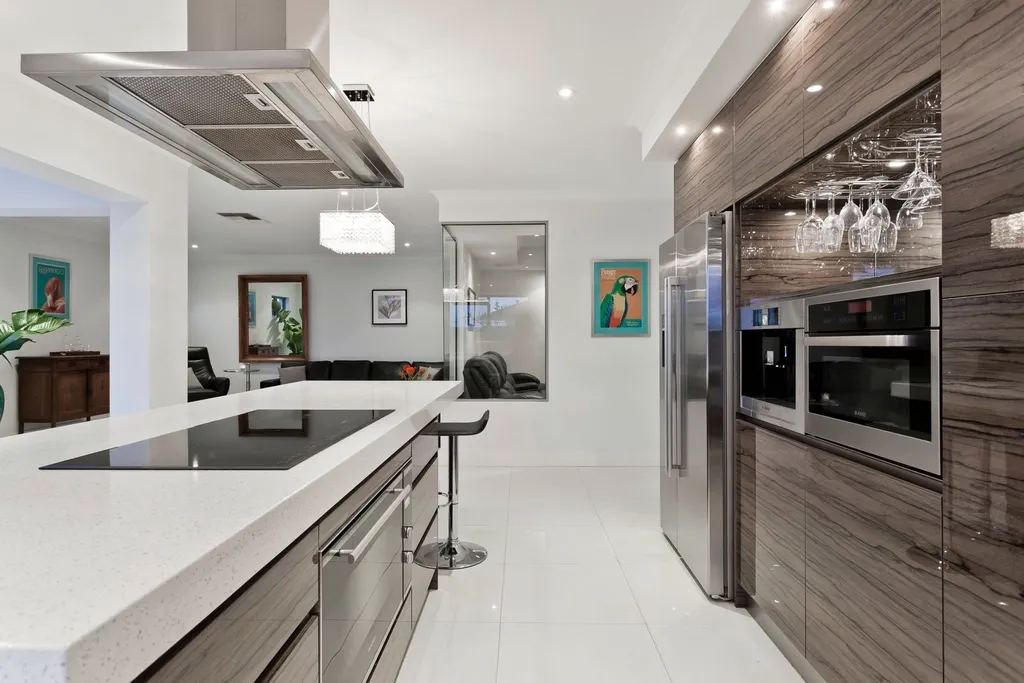 Modern kitchen with wood and grey cabinets and an island